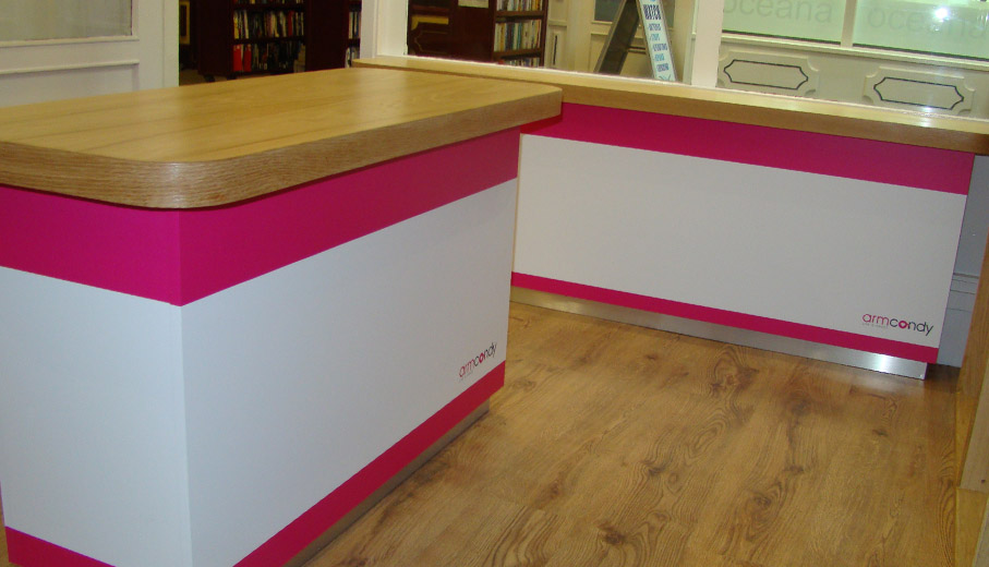 Bespoke shop tables with steam bent solid oak edging and printed graphics