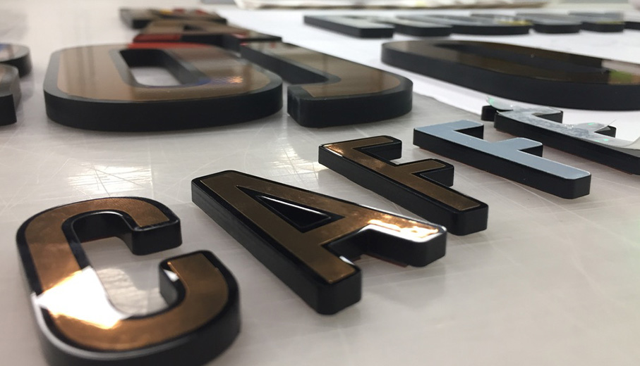 laser cut sign lettering black and copper