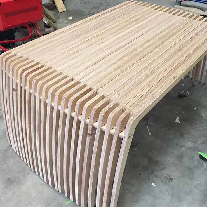 CNC cut extending wooden bench for office