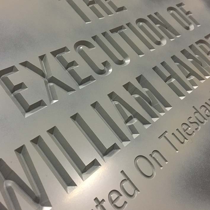 router engraved text with auto carve feature onto sign