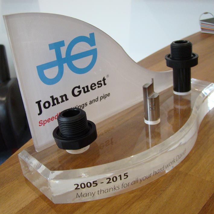 Acrylic award made with corporate branding flame polished edges.