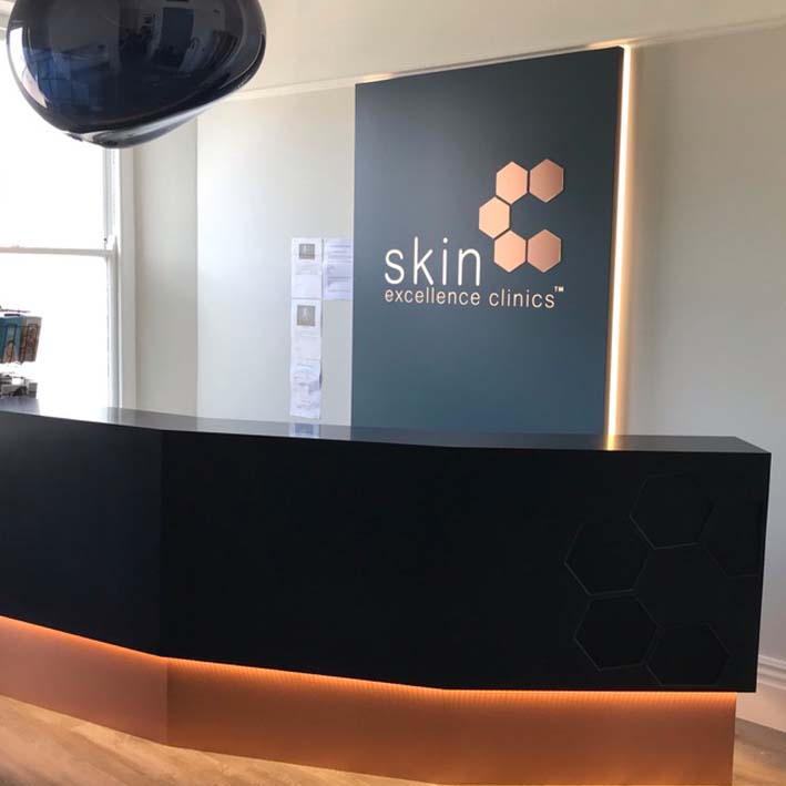 illuminated reception desk and signage