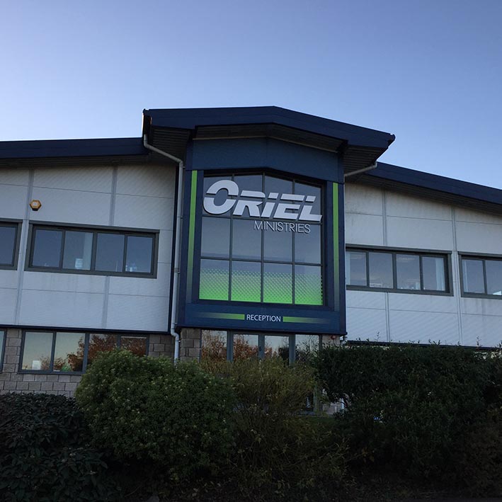 Large sign for offices with building wrap and window graphics