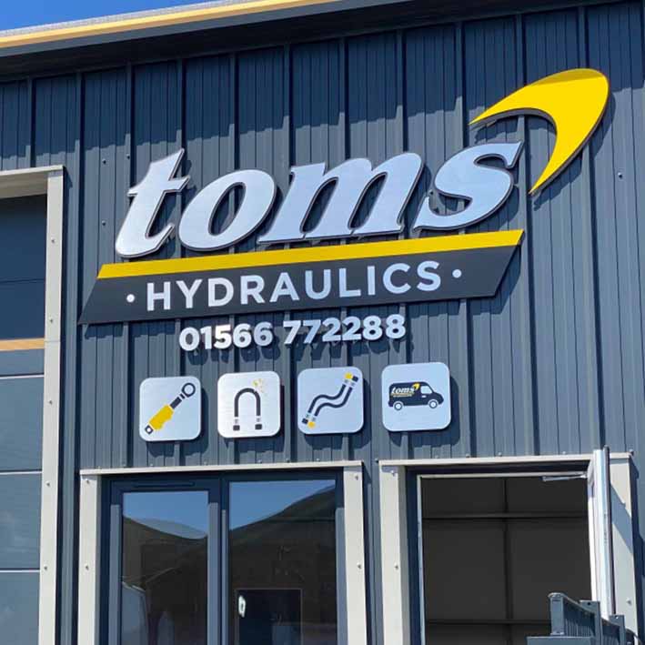 Toms hydraulics sign in Launceston Cornwall